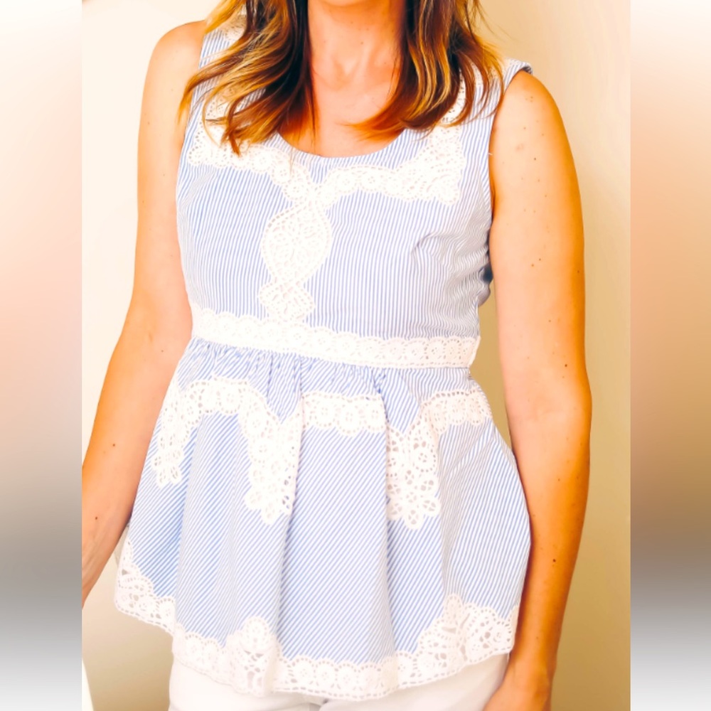 A line top with lace embellishments. NWT